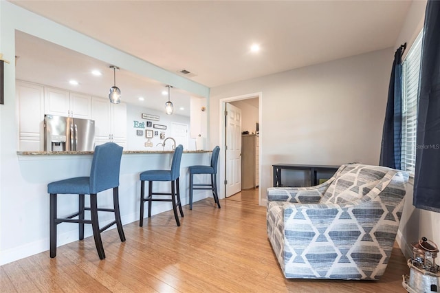 3312 Kenmore Dr, Sarasota, FL 34231 - living area featuring light wood finished floors and recessed lighting
