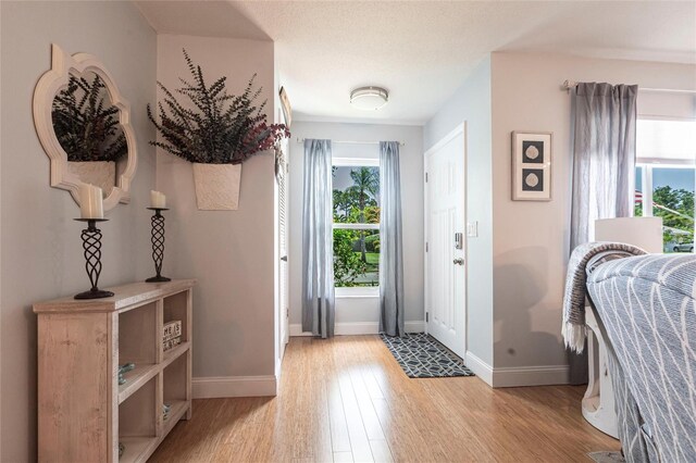 3312 Kenmore Dr, Sarasota, FL 34231 - foyer entrance featuring plenty of natural light and light wood-type flooring