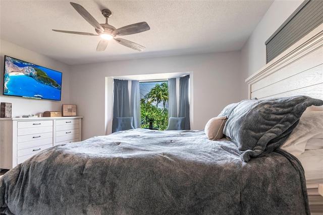 3312 Kenmore Dr, Sarasota, FL 34231 - bedroom with ceiling fan and a textured ceiling