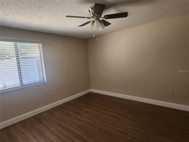 209 Corkwood Ln, Oldsmar, FL 34677 - unfurnished room with dark wood-style flooring, a textured ceiling, and a ceiling fan