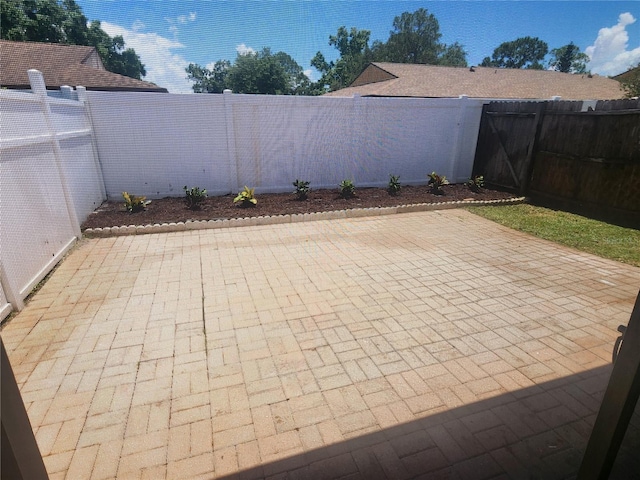 209 Corkwood Ln, Oldsmar, FL 34677 - fenced backyard featuring a patio
