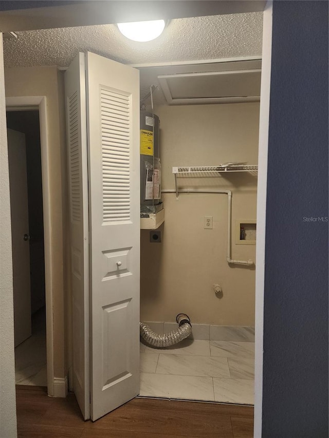 209 Corkwood Ln, Oldsmar, FL 34677 - laundry room with electric dryer hookup and wood finished floors