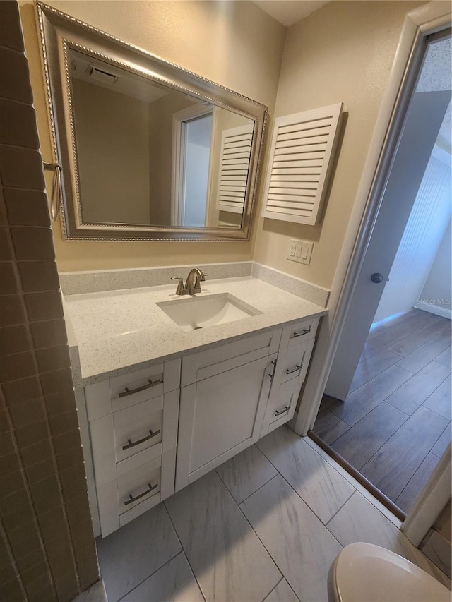 209 Corkwood Ln, Oldsmar, FL 34677 - bathroom featuring vanity and marble finish flooring