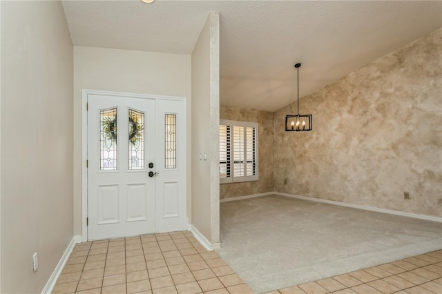 3262 Westcott Ct, Palm Harbor, FL 34684 - foyer with a chandelier, light colored carpet, light tile patterned floors, and vaulted ceiling