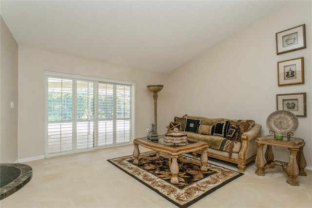 3262 Westcott Ct, Palm Harbor, FL 34684 - carpeted living room featuring vaulted ceiling and baseboards