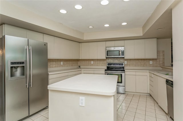 3262 Westcott Ct, Palm Harbor, FL 34684 - kitchen with appliances with stainless steel finishes, light tile patterned floors, light countertops, tasteful backsplash, and recessed lighting