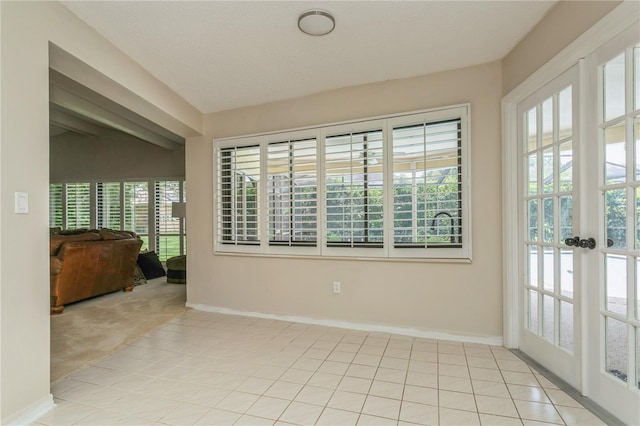 3262 Westcott Ct, Palm Harbor, FL 34684 - unfurnished room with healthy amount of natural light, light tile patterned floors, and vaulted ceiling