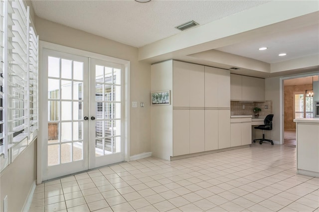 3262 Westcott Ct, Palm Harbor, FL 34684 - unfurnished office with french doors, light tile patterned floors, a textured ceiling, and recessed lighting