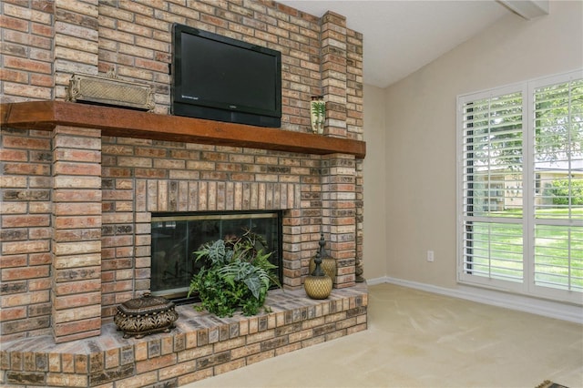 3262 Westcott Ct, Palm Harbor, FL 34684 - detailed view of carpet, a brick fireplace, and beamed ceiling
