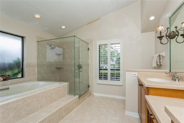 3262 Westcott Ct, Palm Harbor, FL 34684 - full bath with vanity, a stall shower, a bath, lofted ceiling, and tile patterned floors