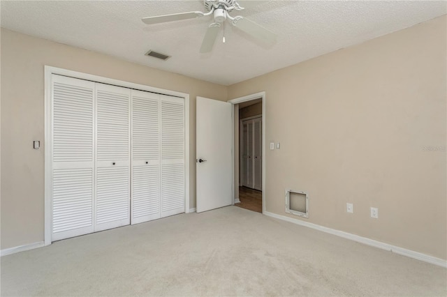 3262 Westcott Ct, Palm Harbor, FL 34684 - unfurnished bedroom with light carpet, a closet, and a ceiling fan