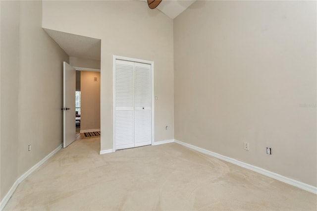 3262 Westcott Ct, Palm Harbor, FL 34684 - unfurnished bedroom featuring light colored carpet and a closet