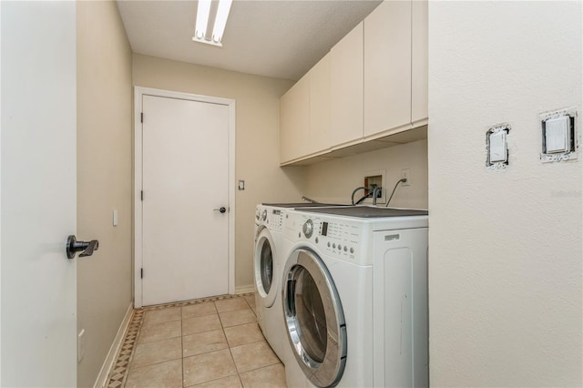 3262 Westcott Ct, Palm Harbor, FL 34684 - laundry area with cabinet space, independent washer and dryer, and light tile patterned floors