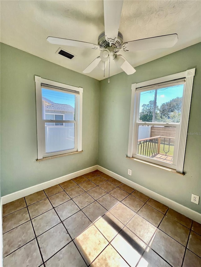 3110 10th Ave N, Saint Petersburg, FL 33713 - unfurnished room featuring light tile patterned floors and ceiling fan