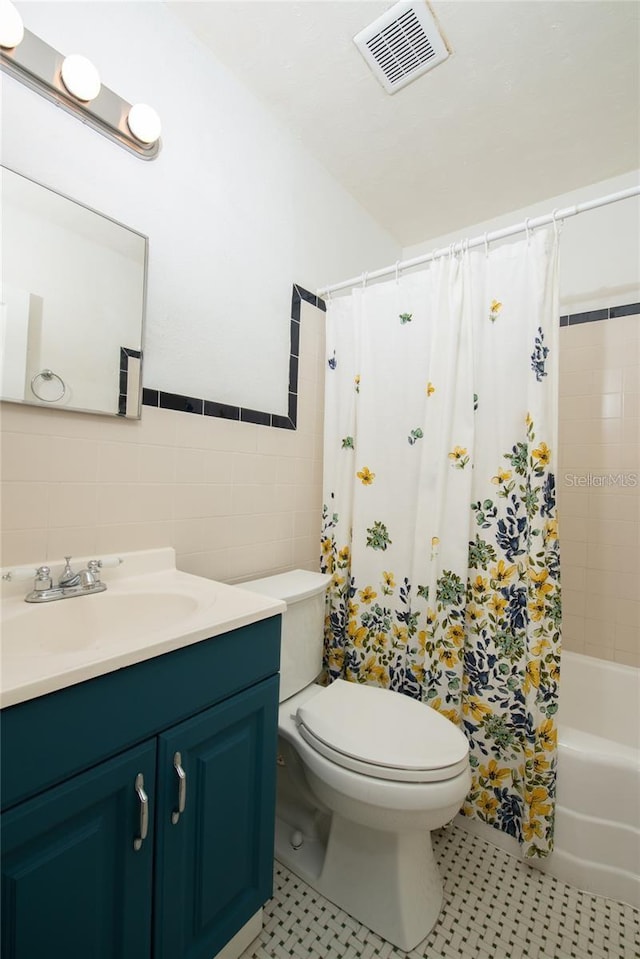 3110 10th Ave N, Saint Petersburg, FL 33713 - bathroom with vanity, tile walls, and shower / bath combination with curtain