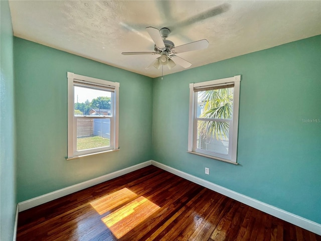 3110 10th Ave N, Saint Petersburg, FL 33713 - spare room featuring dark wood finished floors and ceiling fan