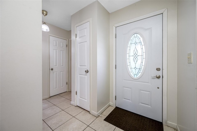 5107 Pine St, Seffner, FL 33584 - foyer featuring light tile patterned floors and baseboards