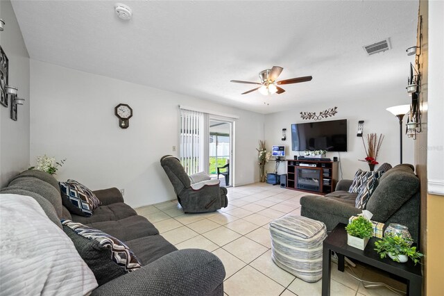 5107 Pine St, Seffner, FL 33584 - living area with light tile patterned flooring and a ceiling fan