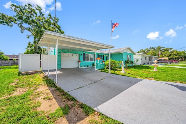 5107 Pine St, Seffner, FL 33584 - view of front of home with concrete driveway, a garage, brick siding, and a carport