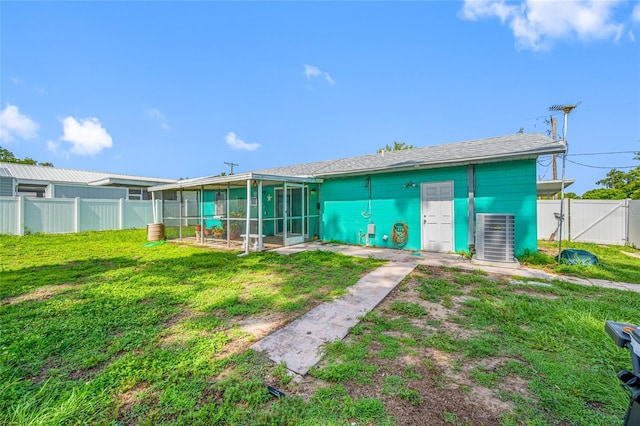 5107 Pine St, Seffner, FL 33584 - rear view of house featuring a gate, a sunroom, and a fenced backyard