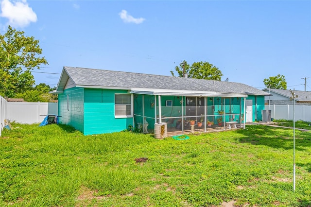 5107 Pine St, Seffner, FL 33584 - back of house with a fenced backyard and a sunroom