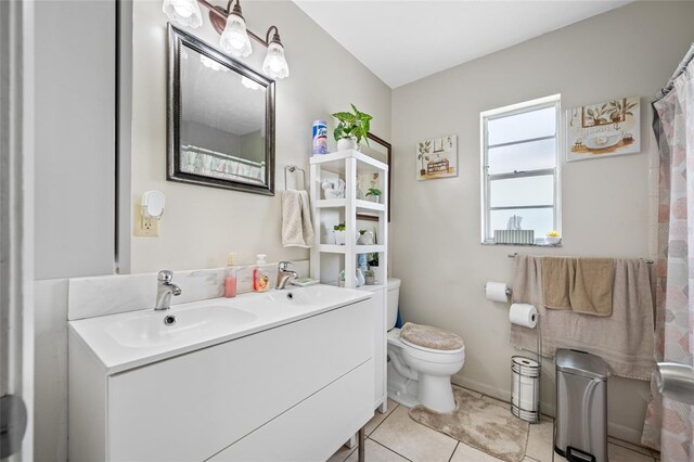 5107 Pine St, Seffner, FL 33584 - bathroom with double vanity and tile patterned flooring