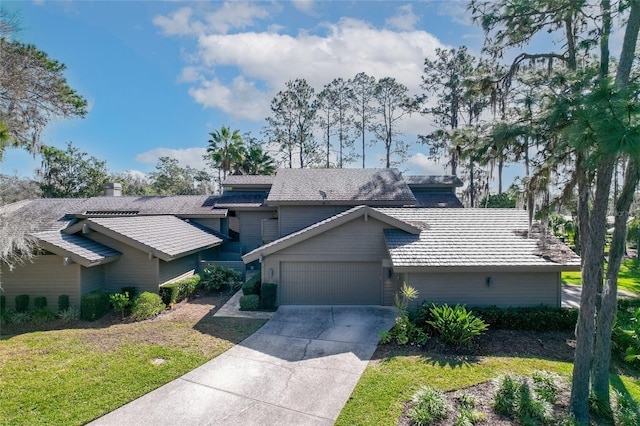 5340 Cobblestone Ct, Wesley Chapel, FL 33543 - view of front of property featuring an attached garage, driveway, and a front lawn