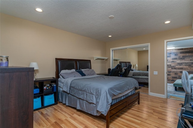 5340 Cobblestone Ct, Wesley Chapel, FL 33543 - bedroom featuring light wood-style floors, recessed lighting, and a textured ceiling