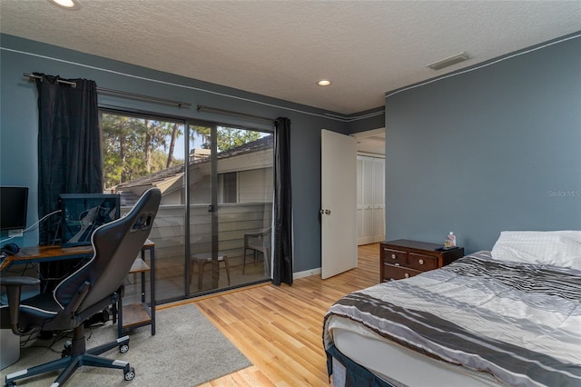 5340 Cobblestone Ct, Wesley Chapel, FL 33543 - bedroom featuring a textured ceiling, wood finished floors, an office area, recessed lighting, and access to exterior