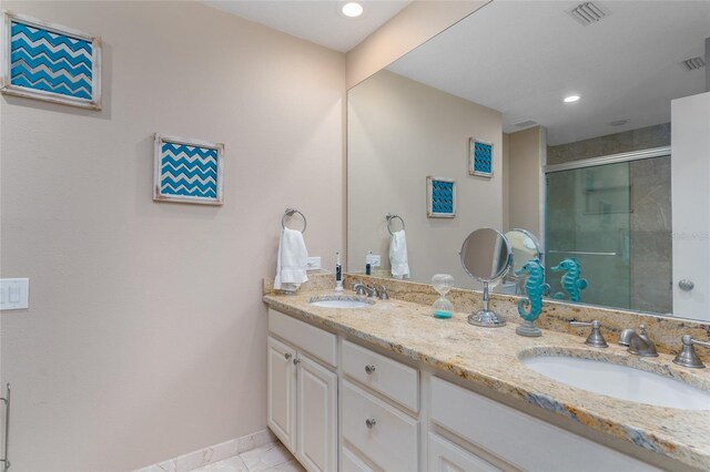 5340 Cobblestone Ct, Wesley Chapel, FL 33543 - bathroom featuring double vanity, a stall shower, recessed lighting, and tile patterned floors