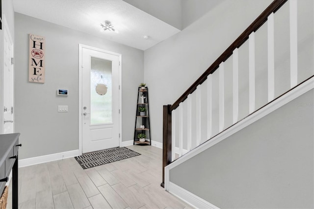 12382 Tibbetts St, Odessa, FL 33556 - entryway featuring stairway and light wood finished floors