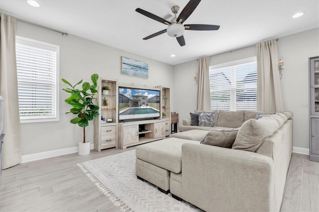 12382 Tibbetts St, Odessa, FL 33556 - living room with ceiling fan, light wood-style flooring, and recessed lighting