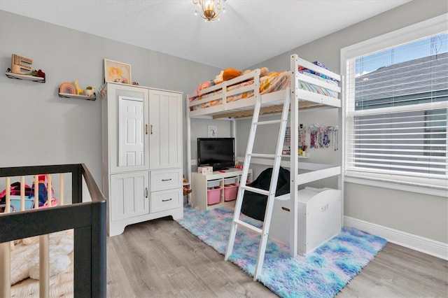 12382 Tibbetts St, Odessa, FL 33556 - bedroom featuring wood finished floors and baseboards