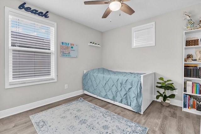 12382 Tibbetts St, Odessa, FL 33556 - bedroom with wood finished floors and ceiling fan