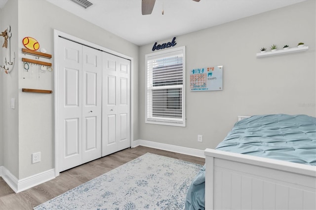 12382 Tibbetts St, Odessa, FL 33556 - bedroom featuring wood finished floors, a closet, and a ceiling fan
