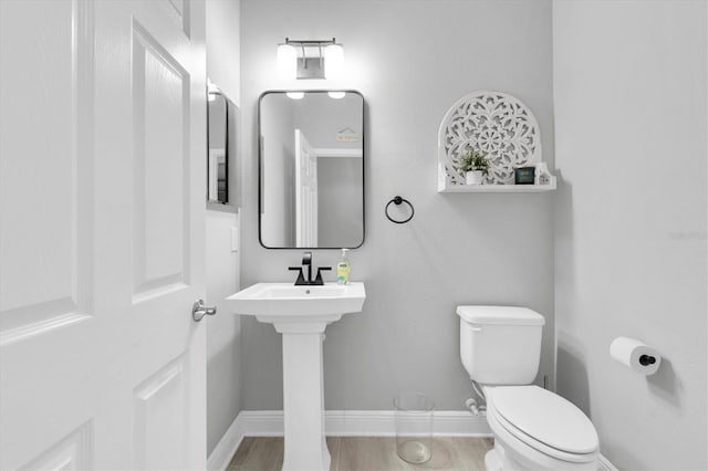 12382 Tibbetts St, Odessa, FL 33556 - half bathroom featuring toilet and baseboards