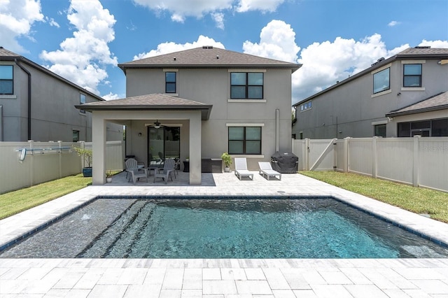 12382 Tibbetts St, Odessa, FL 33556 - rear view of property with stucco siding, a patio area, a ceiling fan, and a fenced backyard