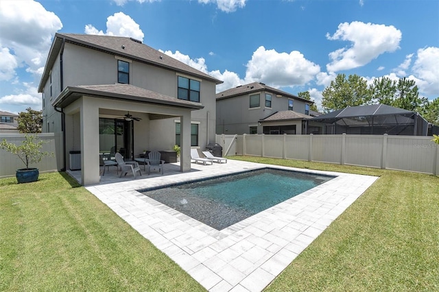 12382 Tibbetts St, Odessa, FL 33556 - back of house with stucco siding, a ceiling fan, a patio, and a fenced backyard