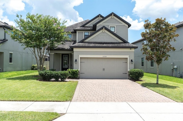 12382 Tibbetts St, Odessa, FL 33556 - view of front of property featuring driveway, roof with shingles, a garage, and a front lawn