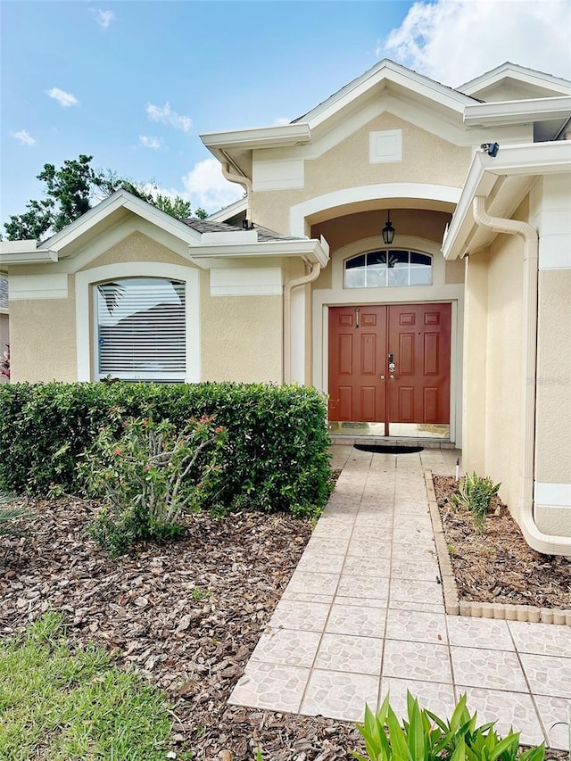 19743 Ellendale Dr, Land O Lakes, FL 34638 - doorway to property featuring stucco siding