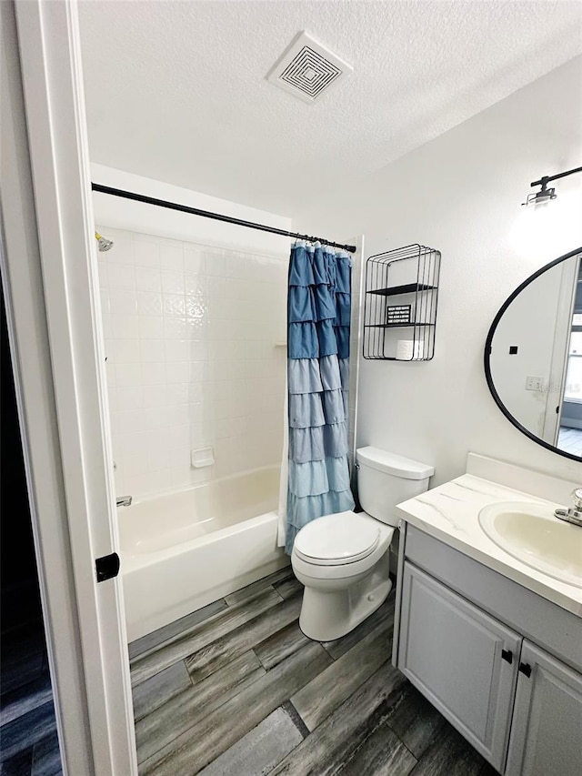 19743 Ellendale Dr, Land O Lakes, FL 34638 - full bath with vanity, a textured ceiling, shower / tub combo, and wood finished floors