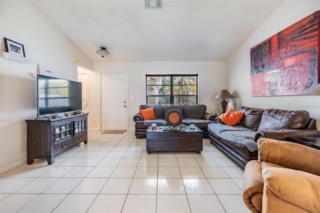 1304 Cedar Ct, Tarpon Springs, FL 34689 - living room featuring light tile patterned flooring, lofted ceiling, and a textured ceiling