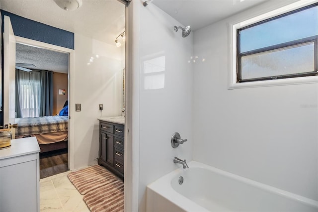 1304 Cedar Ct, Tarpon Springs, FL 34689 - full bathroom with vanity, ensuite bathroom, tub / shower combination, and marble look tiles