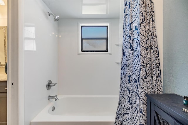 1304 Cedar Ct, Tarpon Springs, FL 34689 - bathroom with shower / bathtub combination with curtain, vanity, and a textured wall