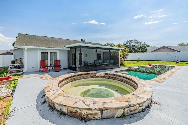 1304 Cedar Ct, Tarpon Springs, FL 34689 - view of pool with french doors, an in-ground hot tub, a patio, a fenced backyard, and a ceiling fan