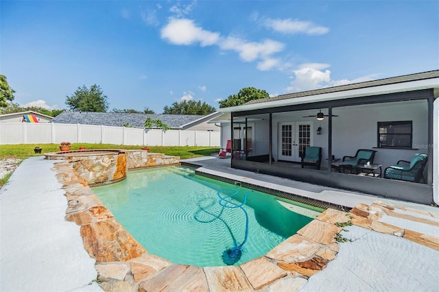 1304 Cedar Ct, Tarpon Springs, FL 34689 - view of swimming pool featuring french doors, a fenced backyard, a ceiling fan, a patio area, and a pool with connected hot tub
