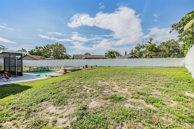 1304 Cedar Ct, Tarpon Springs, FL 34689 - fenced backyard featuring a patio area and a sunroom