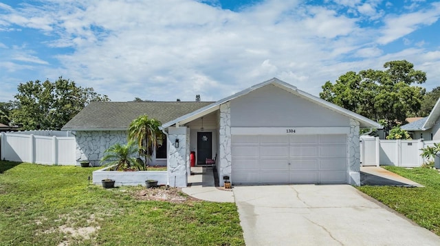 1304 Cedar Ct, Tarpon Springs, FL 34689 - view of front facade with an attached garage and driveway