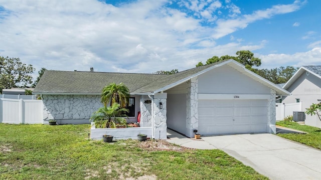 1304 Cedar Ct, Tarpon Springs, FL 34689 - single story home featuring a garage, driveway, and a shingled roof