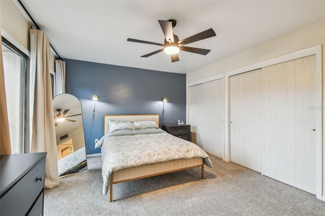 4114 Pinelake Ln Unit 202, Tampa, FL 33618 - carpeted bedroom with two closets and ceiling fan